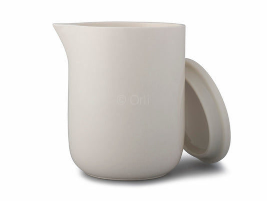 Luxury massage candle ceramic that has a pouring spout and a lid